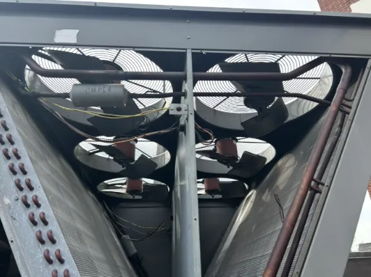 Condenser fans and coils on a commercial unit Brite Mechanical serviced